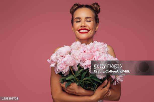 beautiful woman with a bouquet of flowers - peony bouquet stock pictures, royalty-free photos & images