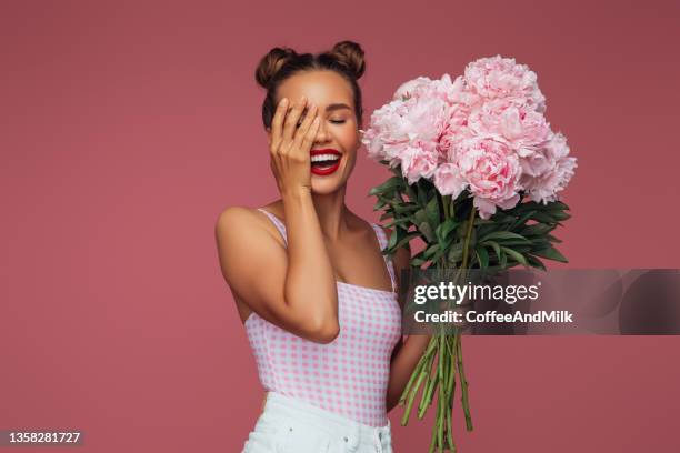 beautiful woman with a bouquet of flowers - peonies bouquet stock pictures, royalty-free photos & images