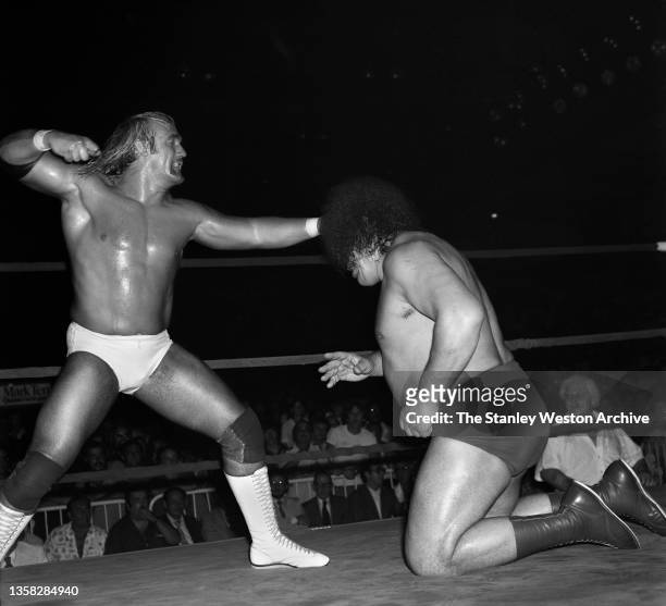 International Wrestling Title event featuring Hulk Hogan and Andre Giant. Pictured here is Hulk Hogan about to deliver a punch to the head of Andre...
