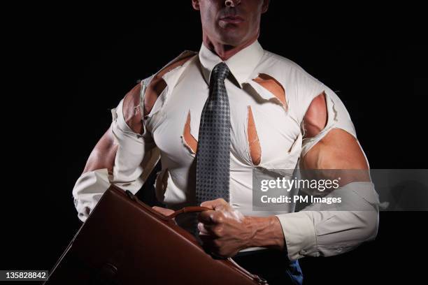 businessman busting out of shirt - torn clothes stock pictures, royalty-free photos & images