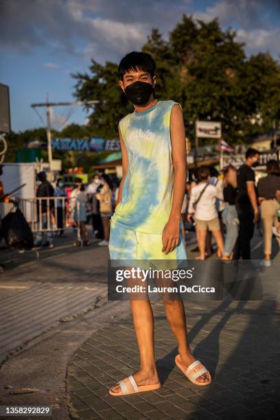 Festival goers pose for portraits on the beach before the concert starts on December 10, 2021 in Pattaya, Thailand. Pattaya hosts its first music...