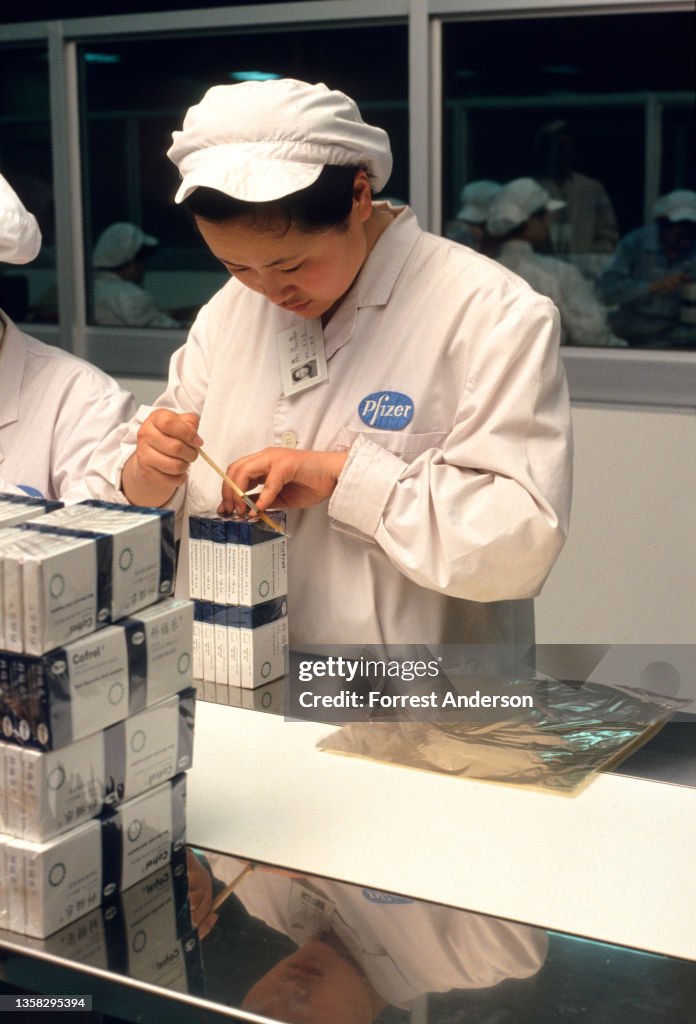 Employee At A Pfizer Factory