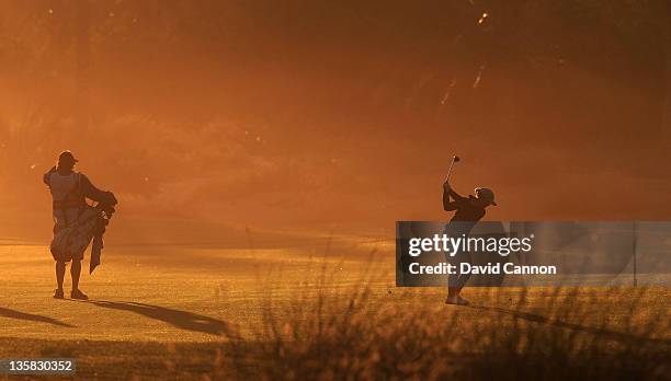 Sophie Walker of England is seen from behind as she plays her second shot against the morning sun on the par 5, 10th hole during the second round of...