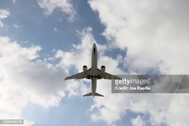 An American Airlines Boeing 787-9 Dreamliner approaches for a landing at the Miami International Airport on December 10, 2021 in Miami, Florida. The...