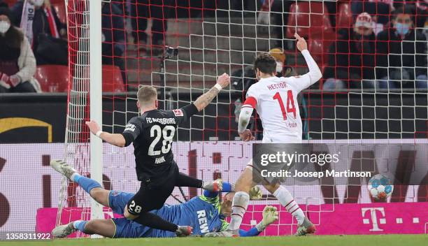 André Hahn of Augsburg scores his goal past Marvin Schwäbe of Cologne during the Bundesliga match between 1. FC Köln and FC Augsburg at...