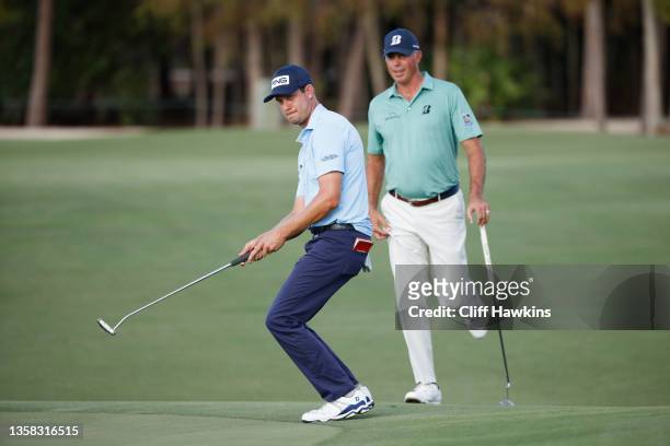 Harris English of the United States reacts to a missed putt as Matt Kuchar of the United States looks on during the first round of the QBE Shootout...