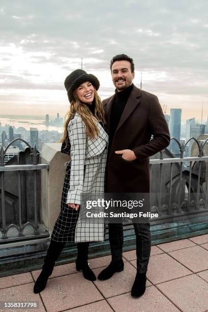 Hannah Brown and Adam Woolard visit 'Top of The Rock' at Rockefeller Center on December 10, 2021 in New York City.