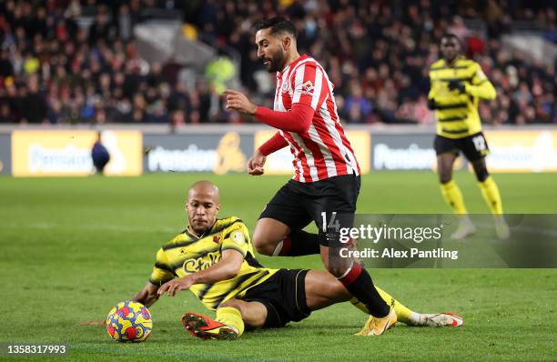 Saman Ghoddos of Brentford is fouled by William Troost-Ekong of Watford FC leading to a penalty during the Premier League match between Brentford and...