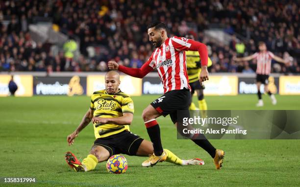 Saman Ghoddos of Brentford is fouled by William Troost-Ekong of Watford FC leading to a penalty during the Premier League match between Brentford and...