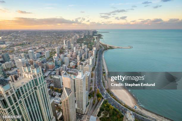 chicago and lake michigan at sunset - chicago old town stock pictures, royalty-free photos & images