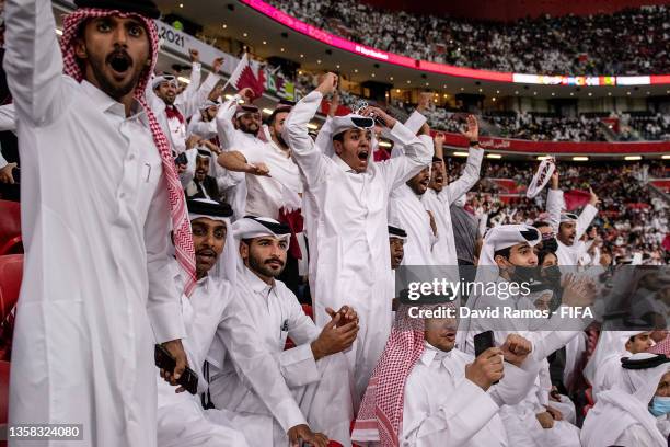 Fans celebrate in the stands during the FIFA Arab Cup Qatar 2021 Quarter-Final match between Qatar and United Arab Emirates at Al Bayt Stadium on...