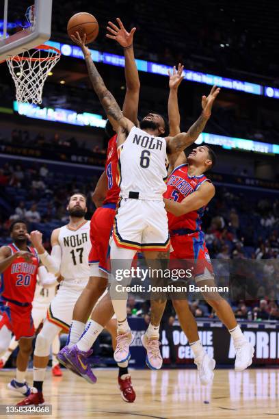 Nickeil Alexander-Walker of the New Orleans Pelicans shoots against Trey Lyles of the Detroit Pistons and Frank Jackson during the first half at the...