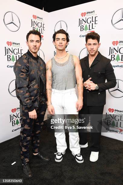 Kevin Jonas, Joe Jonas, and Nick Jonas of The Jonas Brothers attend the iHeartRadio Z100 Jingle Ball 2021 on December 10, 2021 in New York City.