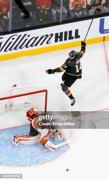 Carter Hart of the Philadelphia Flyers makes a save against Nicolas Hague of the Vegas Golden Knights in the first period of their game at T-Mobile...