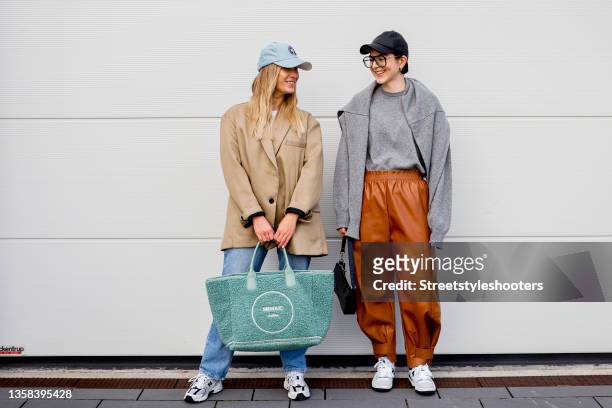 December 10: Katharina Bonmann, wearing a caramel oversized blazer by The Frankie Shop, a white crop top by Zara, wide leg jeans by Mango x Pernille...