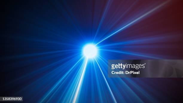 blue light rays - exploding light in outer space stock-fotos und bilder