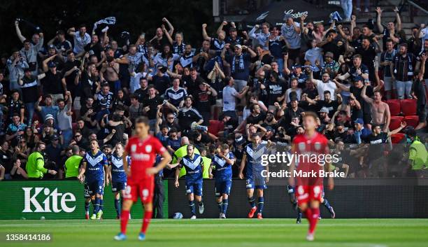 Melbourne Victory fans celebrates their teams first goal during the A-League Mens match between Adelaide United and Melbourne Victory at Coopers...