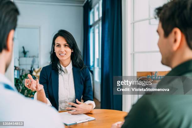 group of business persons talking in the office. - explaining stock pictures, royalty-free photos & images