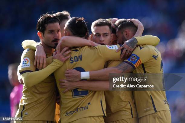 Jorge De Frutos of Levante celebrates with teammates after scoring their team's first goal during the La Liga Santander match between RCD Espanyol...