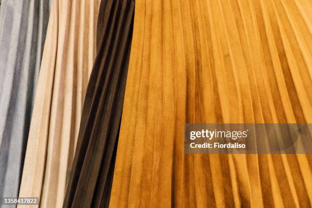 textile background - pleated skirt stock-fotos und bilder