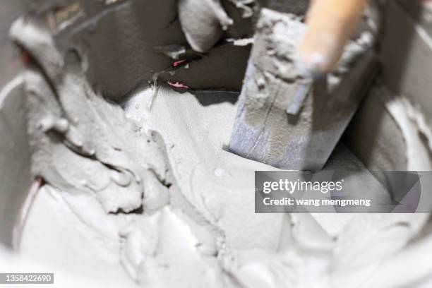 mixing cement - plasterer stock pictures, royalty-free photos & images