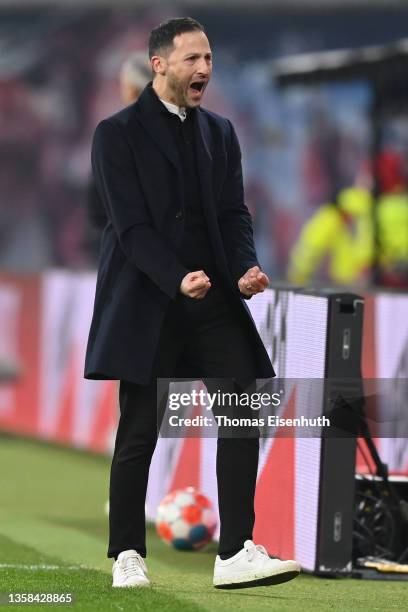 Domenico Tedesco, head coach of Leipzig celebrates his team's fist goal during his debut game as head coach during the Bundesliga match between RB...