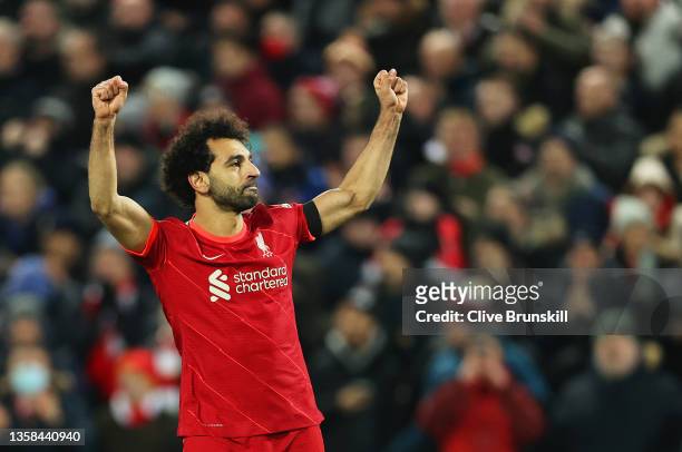 Mohamed Salah of Liverpool celebrates after scoring their side's first goal from the penalty spot during the Premier League match between Liverpool...