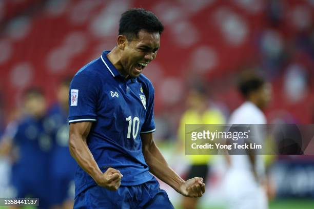 Teerasil Dangda of Thailand celebrates after scoring the first goal against Myanmar during the first half of their AFF Suzuki Cup Group A game at the...