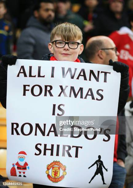 Fan of Manchester United holds up a sign asking for the shirt of Cristiano Ronaldo of Manchester United prior to the Premier League match between...