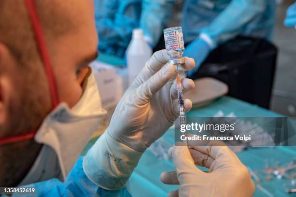 Nurses prepare and check vaccine syringes at FieraMesse, the Bolzano trade fair center, during the Covid 19 vaccination marathon in South Tyrol, on...