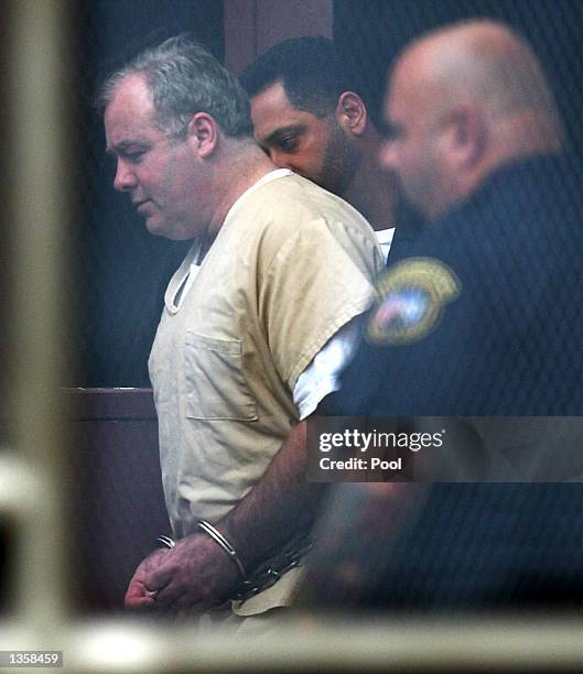 Michael Skakel leaves Superior Court in handcuffs after the first day of his sentencing hearing August 28, 2002 in Norwalk, Connecticut. Skakel was...