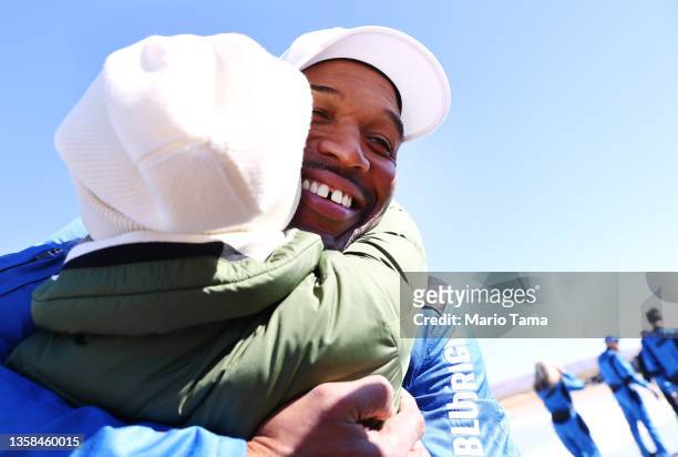 Good Morning America co-anchor and former NFL star Michael Strahan embraces a well-wisher during a media availability on the landing pad after he...