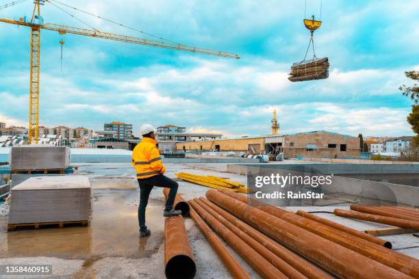 construction engineer or architect and cranes - hoist stock pictures, royalty-free photos & images