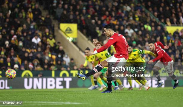 Cristiano Ronaldo of Manchester United scores their side's first goal from the penalty spot during the Premier League match between Norwich City and...