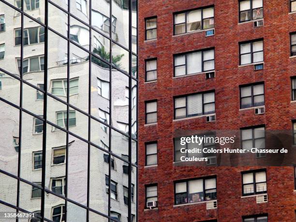 red brick and glass buildings with reflection of a third building in nyc - hunter, new york stock-fotos und bilder