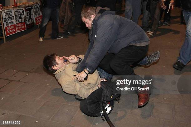 Fight breaks out following a speech by veteran civil rights campaigner Reverend Jesse Jackson at the Occupy London Stock Exchange camp outside St...