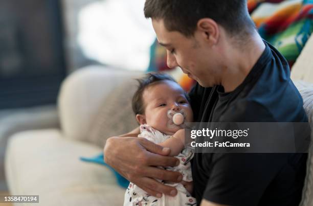 149 Dad Rocking Baby Stock Photos, High-Res Pictures, and Images ...