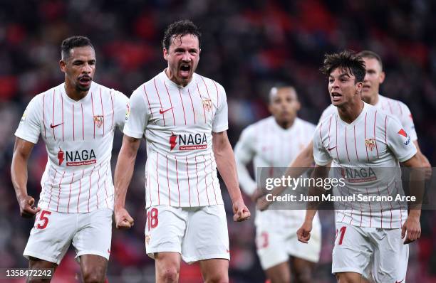 Thomas Delaney of Sevilla celebrates with team mates after scoring their side's first goal during the La Liga Santander match between Athletic Club...