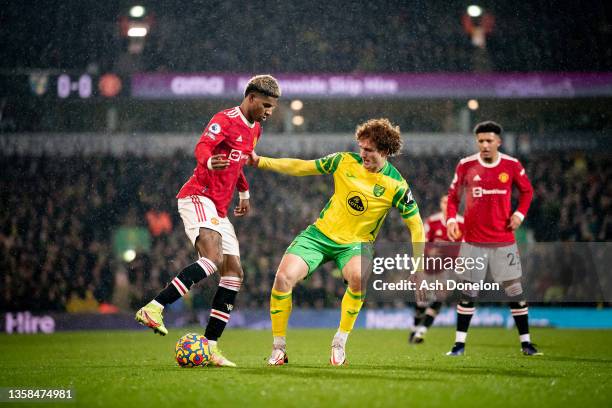 Marcus Rashford of Manchester United in action during with Josh Sargent of Norwich City the Premier League match between Norwich City and Manchester...