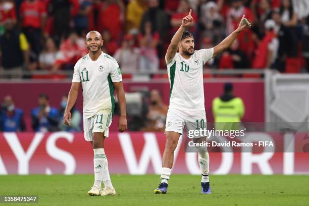 Mohammed Belaili of Algeria celebrates with teammate Yacine Brahimi after scoring their team's second goal during the FIFA Arab Cup Qatar 2021...