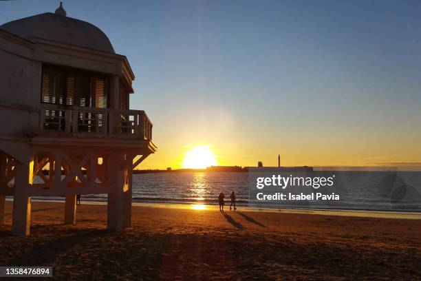 sunset at la caleta beach, cadiz, spain - cádiz stock pictures, royalty-free photos & images