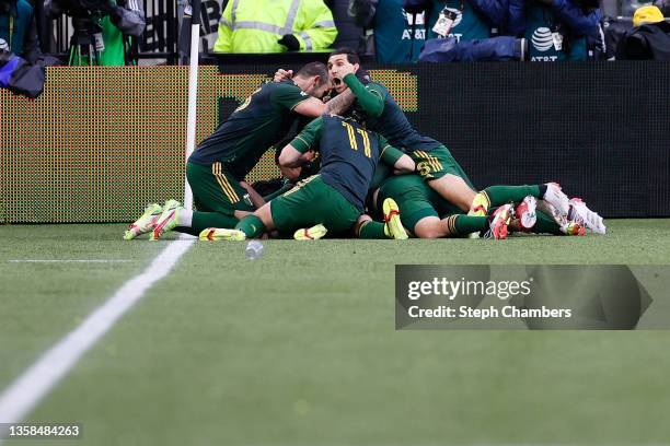 Members of the Portland Timbers celebrate a goal by Felipe Mora against New York City during the second half of the 2021 MLS Cup final at Providence...