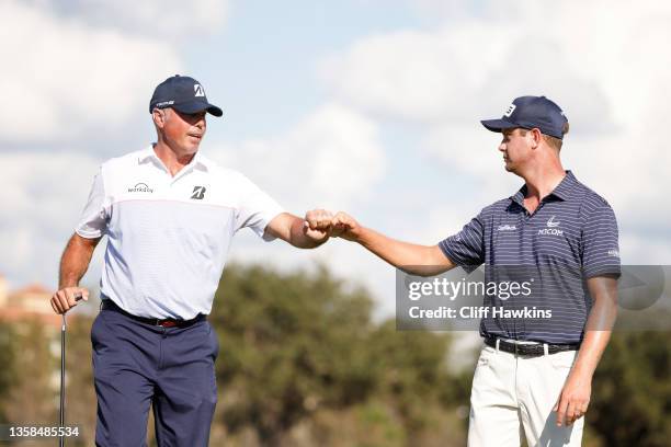Matt Kuchar of the United States and Harris English of the United States react on the ninth green during the second round of the QBE Shootout at...