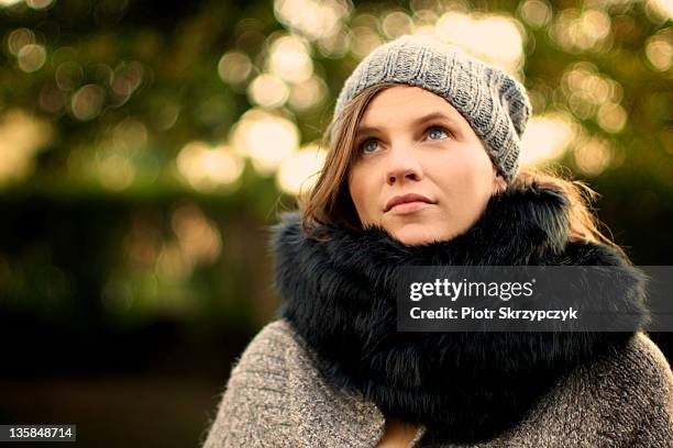 woman wearing faux fur black scarf - fake fur stock pictures, royalty-free photos & images