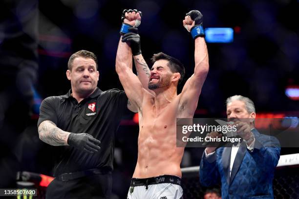 Dominick Cruz reacts after being declared the winner by decision against Pedro Munhoz of Brazil in their bantamweight bout during the UFC 269 on...