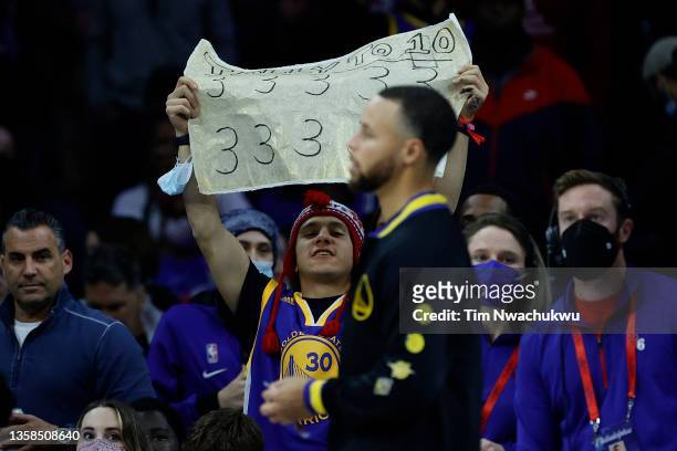 Spectator displays a sign before a game between the Philadelphia 76ers and Golden State Warriors at Wells Fargo Center on December 11, 2021 in...