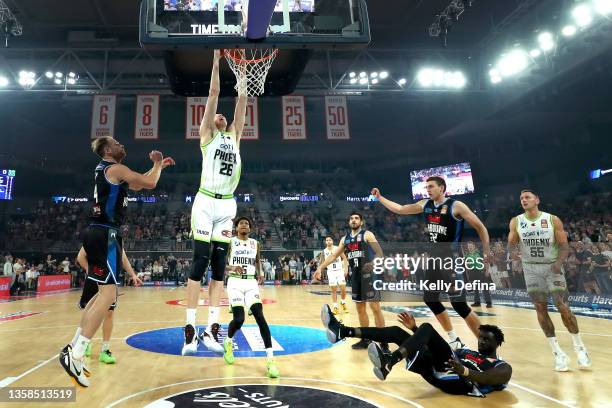 Zhou Qi of the Phoenix slam dunks during the round two NBL match between Melbourne United and South East Melbourne Phoenix at John Cain Arena on...