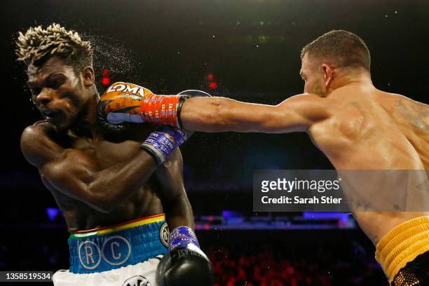 Vasiliy Lomachenko trades punches with Richard Commey during their WBO Intercontinental Lightweight Title fight at Madison Square Garden on December...