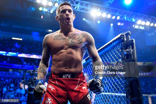 Dustin Poirier reacts as he enters the ring before his UFC lightweight championship bout against Charles Oliveira of Brazil during the UFC 269 on...