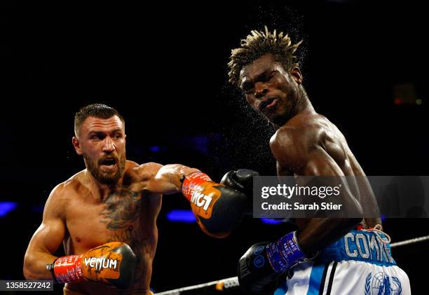 Vasiliy Lomachenko trades punches with Richard Commey during their WBO Intercontinental Lightweight Title fight at Madison Square Garden on December...